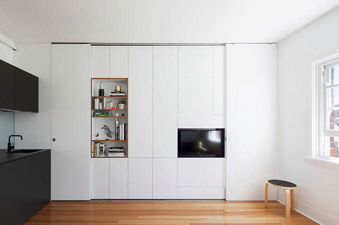 micro-apartment-design-white-storage-wall