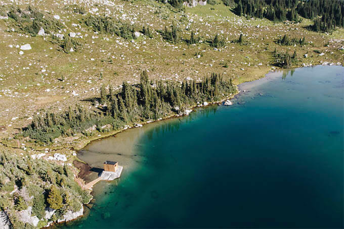travel adventure lakeside sauna aerial view